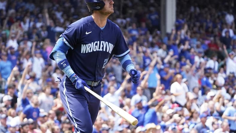 Jul 21, 2023; Chicago, Illinois, USA; Chicago Cubs first baseman Cody Bellinger (24) hits a two-run home run against the St. Louis Cardinals during the third inning at Wrigley Field. Mandatory Credit: David Banks-USA TODAY Sports