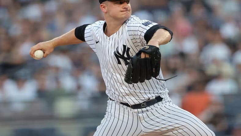 Jul 21, 2023; Bronx, New York, USA; New York Yankees starting pitcher Clarke Schmidt (36) pitches against the Kansas City Royals during the first inning at Yankee Stadium. Mandatory Credit: Brad Penner-USA TODAY Sports