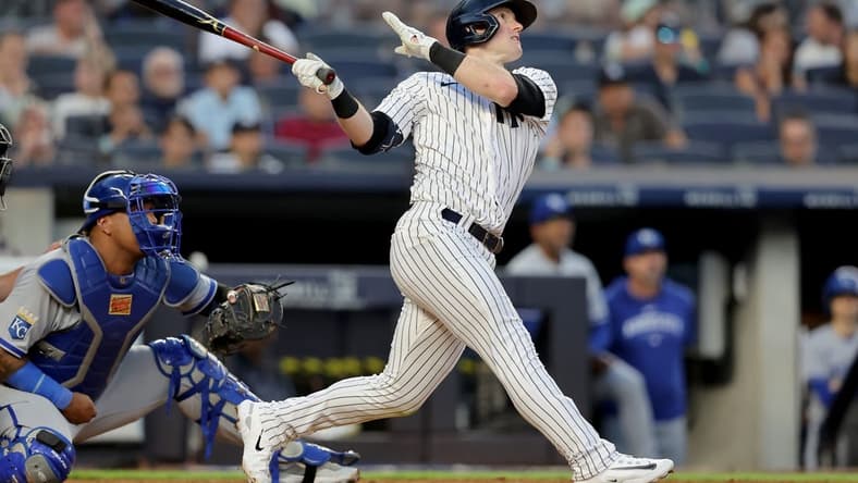 Jul 21, 2023; Bronx, New York, USA; New York Yankees center fielder Billy McKinney (57) follows through on a three run home run against the Kansas City Royals during the fourth inning at Yankee Stadium. Mandatory Credit: Brad Penner-USA TODAY Sports