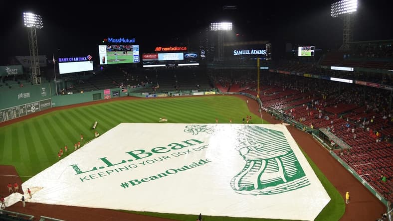 Jul 21, 2023; Boston, Massachusetts, USA;  The Boston Red Sox grounds crew puts the tarp on the field during the fourth inning against the New York Mets at Fenway Park. Mandatory Credit: Bob DeChiara-USA TODAY Sports