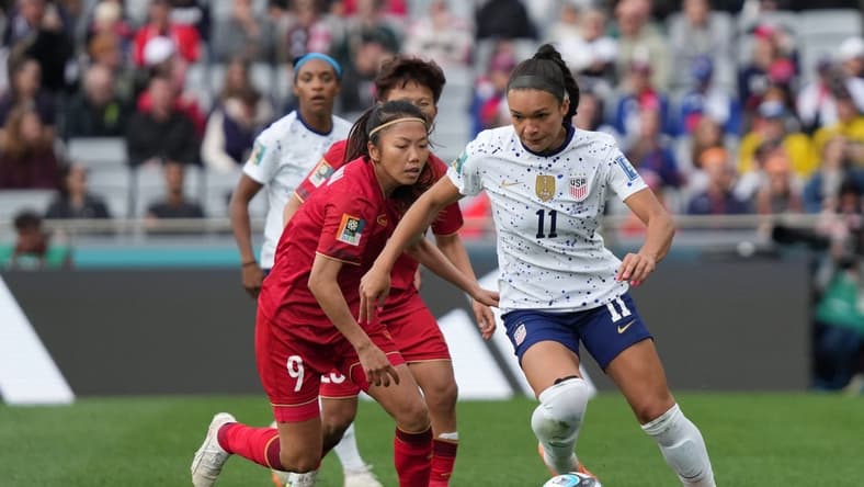 Jul 22, 2023; Auckland, NZL; USA forward Sophia Smith (11) gets the ball past Vietnam forward Huynh Nhu (9) in the second half of a group stage match in the 2023 FIFA Women's World Cup at Eden Park. Mandatory Credit: Jenna Watson-USA TODAY Sports