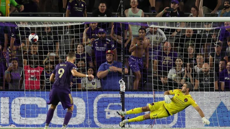 Jul 21, 2023; Orlando, FL, USA; Orlando City forward Ercan Kara (9) scores a goal during the penalty kick shoot out after the game against Houston Dynamo at Exploria Stadium. Mandatory Credit: Cory Knowlton-USA TODAY Sports