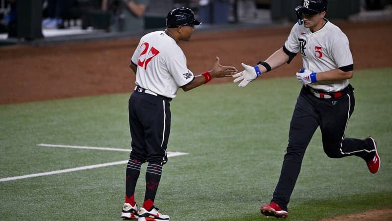 Jul 21, 2023; Arlington, Texas, USA; Texas Rangers shortstop Corey Seager (5) rounds the bases past third base coach Tony Beasley (27) after he hits a home run against the Los Angeles Dodgers during the sixth inning at Globe Life Field. Mandatory Credit: Jerome Miron-USA TODAY Sports
