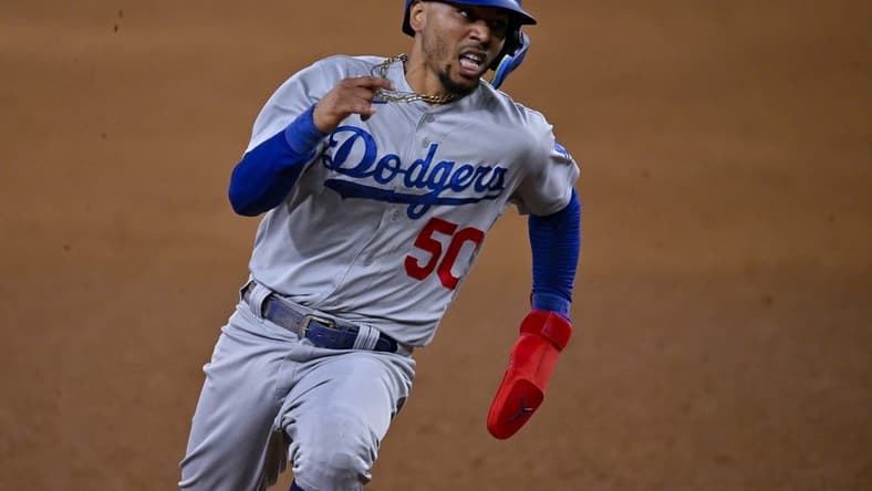 Jul 21, 2023; Arlington, Texas, USA; Los Angeles Dodgers right fielder Mookie Betts (50) scores against the Texas Rangers during the eighth inning at Globe Life Field. Mandatory Credit: Jerome Miron-USA TODAY Sports