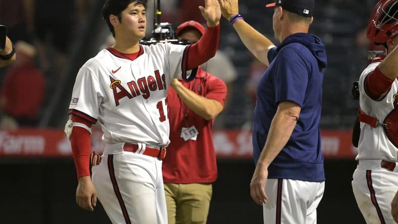 Jul 21, 2023; Anaheim, California, USA; Los Angeles Angels starting pitcher Shohei Ohtani (17) high fives as he leaves the field following the ninth inning against the Pittsburgh Pirates at Angel Stadium. Mandatory Credit: Jayne Kamin-Oncea-USA TODAY Sports