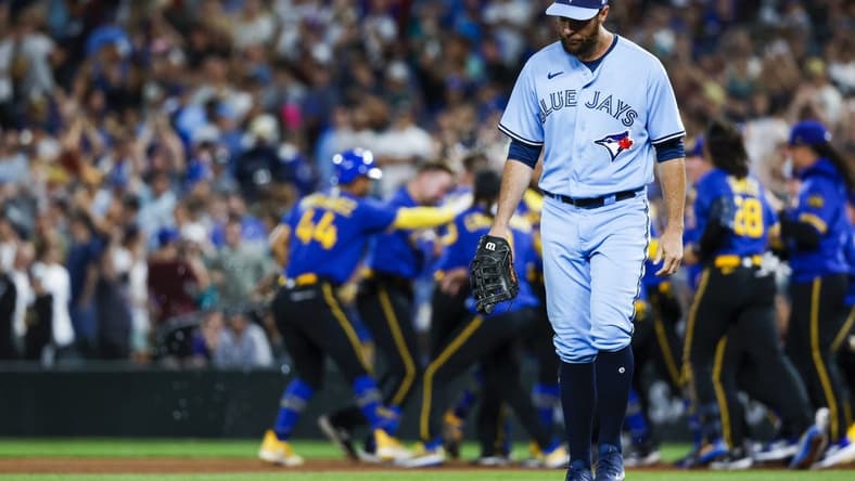 Jul 21, 2023; Seattle, Washington, USA; Toronto Blue Jays first baseman Brandon Belt (13) walks back to the dugout following a 3-2 loss to the Seattle Mariners during the ninth inning at T-Mobile Park. Mandatory Credit: Joe Nicholson-USA TODAY Sports