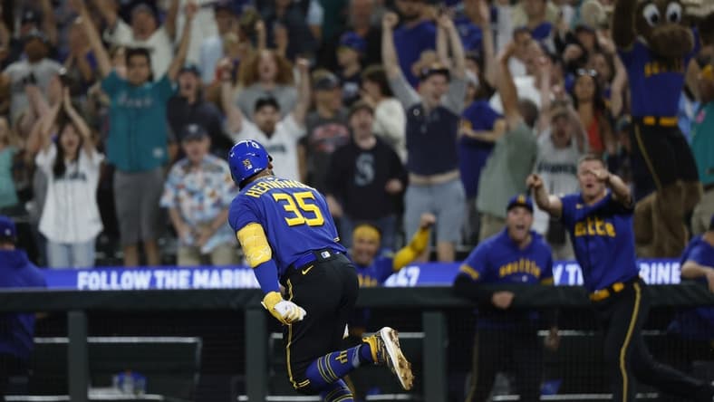 Jul 21, 2023; Seattle, Washington, USA; Seattle Mariners designated hitter Teoscar Hernandez (35) reacts towards the dugout after hitting a walk-off RBI-single against the Toronto Blue Jays during the ninth inning at T-Mobile Park. Mandatory Credit: Joe Nicholson-USA TODAY Sports