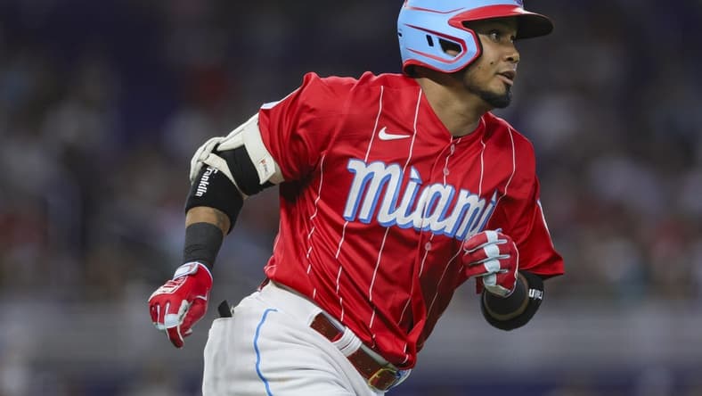 Jul 22, 2023; Miami, Florida, USA; Miami Marlins second baseman Luis Arraez (3) runs toward second base after hitting a double against the Colorado Rockies during the third inning at loanDepot Park. Mandatory Credit: Sam Navarro-USA TODAY Sports
