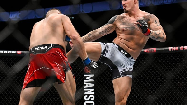 Jul 22, 2023; London, UNITED KINGDOM; Tom Aspinall (red gloves) fights Marcin Tybura (blue gloves) during UFC Fight Night at O2 Arena. Mandatory Credit: Per Haljestam-USA TODAY Sports