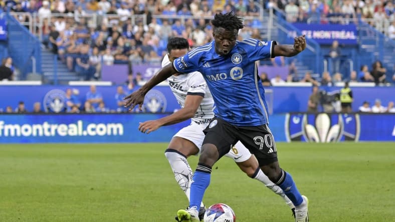 Jul 22, 2023; Montreal, Quebec, CAN; CF Montreal forward Kwadwo Opoku (90) dribbles against UNAM defender Nathan Silva (6) during the first half of a Leagues Cup game at Stade Saputo. Mandatory Credit: Eric Bolte-USA TODAY Sports