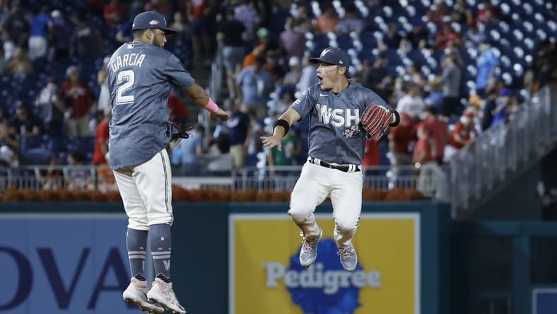 Jul 22, 2023; Washington, District of Columbia, USA; Washington Nationals second baseman Luis Garcia (2) celebrates with Nationals center fielder Alex Call (17) after their game against the San Francisco Giants at Nationals Park. Mandatory Credit: Geoff Burke-USA TODAY Sports