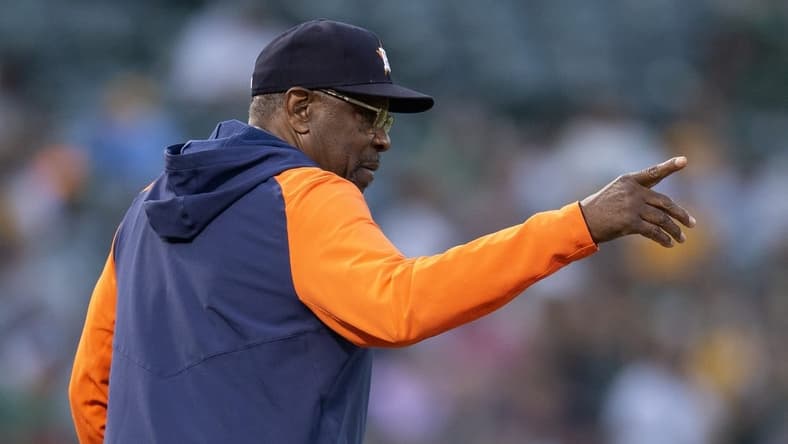 Jul 22, 2023; Oakland, California, USA; Houston Astros manager Dusty Baker Jr. summons a relief pitcher during the sixth inning against the Oakland Athletics at Oakland-Alameda County Coliseum. Mandatory Credit: D. Ross Cameron-USA TODAY Sports