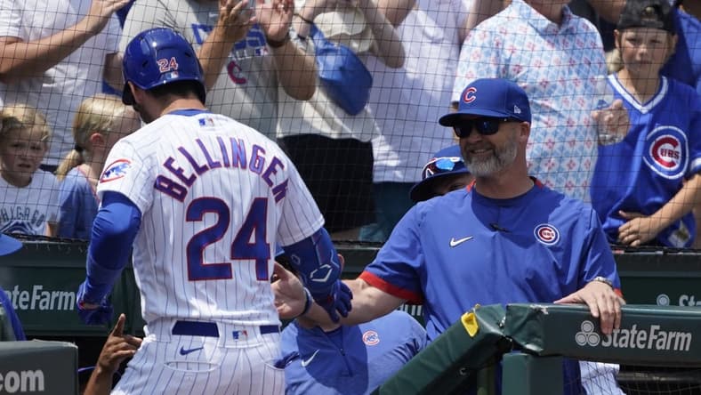 Jul 23, 2023; Chicago, Illinois, USA; Chicago Cubs center fielder Cody Bellinger (24) is greeted by Chicago Cubs manager David Ross (3) after hitting a two-run homer against the St. Louis Cardinals during the first inning at Wrigley Field. Mandatory Credit: David Banks-USA TODAY Sports