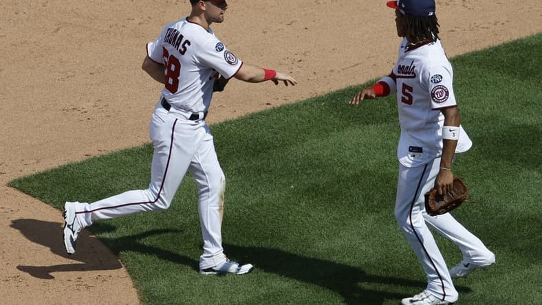 Jul 23, 2023; Washington, District of Columbia, USA; Washington Nationals right fielder Lane Thomas (28) celebrates with Nationals shortstop CJ Abrams (5) after their game San Francisco Giants at Nationals Park. Mandatory Credit: Geoff Burke-USA TODAY Sports