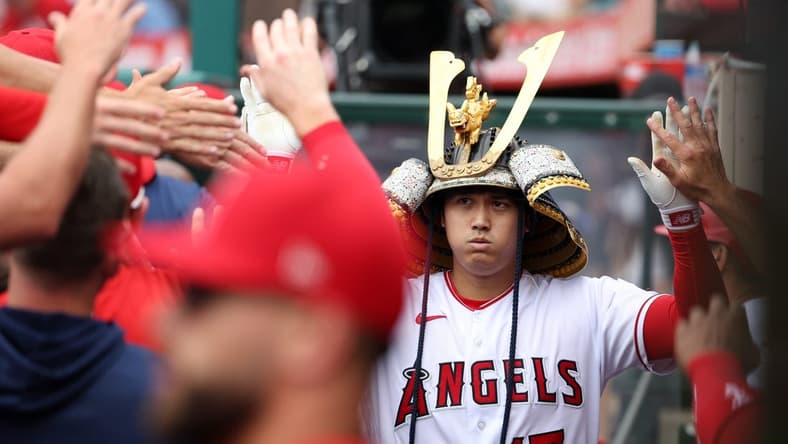 Jul 23, 2023; Anaheim, California, USA;  Los Angeles Angels designated hitter Shohei Ohtani (17) is greeted in the dugout after hitting a home run during the first inning against the Pittsburgh Pirates at Angel Stadium. Mandatory Credit: Kiyoshi Mio-USA TODAY Sports