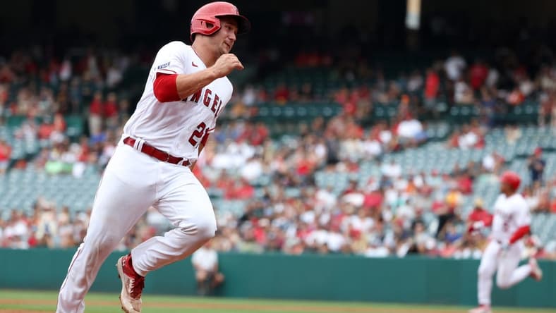 Jul 23, 2023; Anaheim, California, USA; Los Angeles Angels catcher Matt Thaiss (21) runs to a third on RBI double by first baseman Eduardo Escobar (5) during the second inning against the Pittsburgh Pirates at Angel Stadium. Mandatory Credit: Kiyoshi Mio-USA TODAY Sports