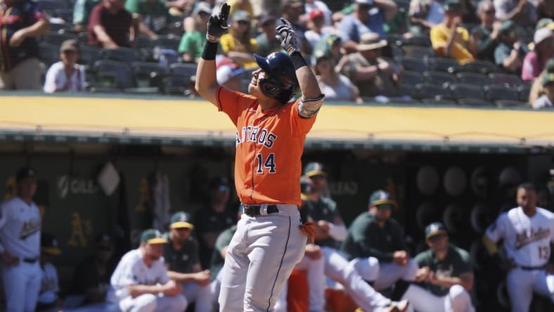 Jul 23, 2023; Oakland, California, USA; Houston Astros second baseman Mauricio Dubon (14) celebrates after hitting a solo home run against the Oakland Athletics during the ninth inning at Oakland-Alameda County Coliseum. Mandatory Credit: Kelley L Cox-USA TODAY Sports