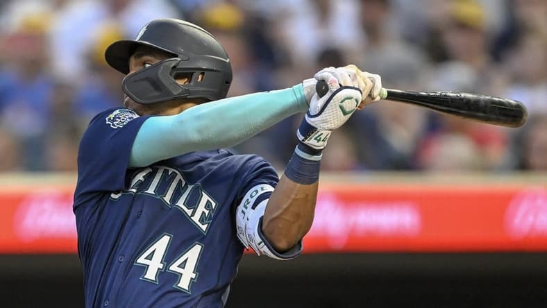 Jul 24, 2023; Minneapolis, Minnesota, USA; Seattle Mariners infielder Julio Rodriguez (44) hits a single against the Minnesota Twins during the eighth inning at Target Field. Mandatory Credit: Nick Wosika-USA TODAY Sports