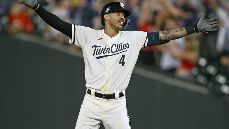 Jul 24, 2023; Minneapolis, Minnesota, USA; Minnesota Twins infielder Carlos Correa (4) celebrates his walk-off RBI single against the Seattle Mariners during the tenth inning at Target Field. Mandatory Credit: Nick Wosika-USA TODAY Sports