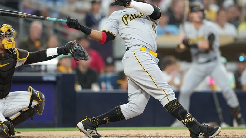 Jul 24, 2023; San Diego, California, USA;  Pittsburgh Pirates first baseman Carlos Santana (41) hits a home run against the San Diego Padres during the fifth inning at Petco Park. Mandatory Credit: Ray Acevedo-USA TODAY Sports