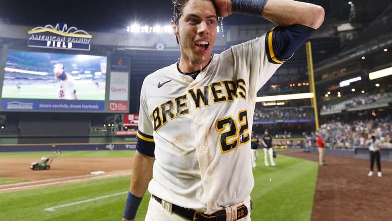 Jul 24, 2023; Milwaukee, Wisconsin, USA;  Milwaukee Brewers left fielder Christian Yelich (22) reacts after being dunked with Gatorade following the game against the Cincinnati Reds at American Family Field. Mandatory Credit: Jeff Hanisch-USA TODAY Sports
