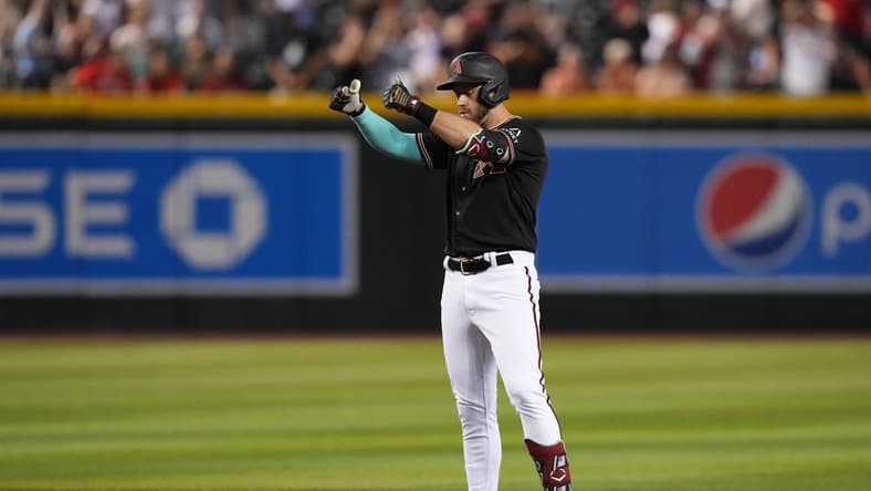 iJul 24, 2023; Phoenix, Arizona, USA; Arizona Diamondbacks third baseman Evan Longoria (3) reacts after hitting a two RBI double against the St. Louis Cardinals during the seventh inning at Chase Field. Mandatory Credit: Joe Camporeale-USA TODAY Sports