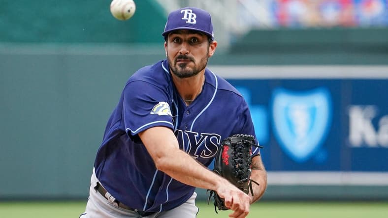 Jul 16, 2023; Kansas City, Missouri, USA; Tampa Bay Rays starting pitcher Zach Eflin (24) delivers a pitch against the Kansas City Royals prior to a game at Kauffman Stadium. Mandatory Credit: Denny Medley-USA TODAY Sports