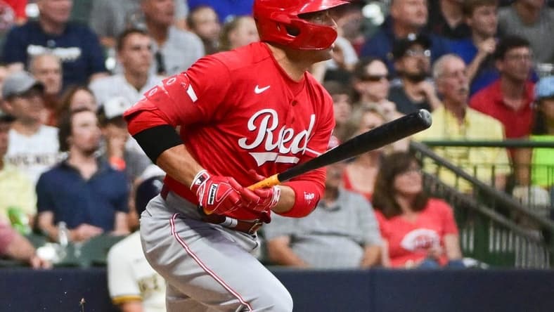 Jul 25, 2023; Milwaukee, Wisconsin, USA; Cincinnati Reds first baseman Joey Votto (19) drives in a run with a base hit in the fourth inning against the Milwaukee Brewers at American Family Field. Mandatory Credit: Benny Sieu-USA TODAY Sports