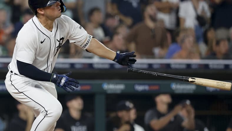 Jul 25, 2023; Detroit, Michigan, USA; Detroit Tigers first baseman Spencer Torkelson (20) hits a two RBI ground rule double in the ninth inning against the Los Angeles Angels at Comerica Park. Mandatory Credit: Rick Osentoski-USA TODAY Sports