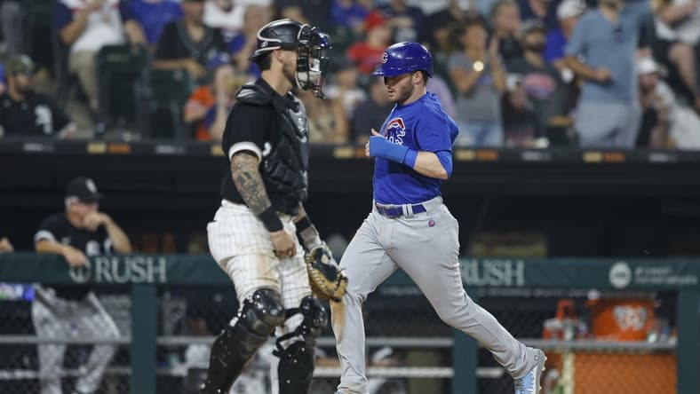 Jul 25, 2023; Chicago, Illinois, USA; Chicago Cubs left fielder Ian Happ (8) scores against the Chicago White Sox during the seventh inning at Guaranteed Rate Field. Mandatory Credit: Kamil Krzaczynski-USA TODAY Sports