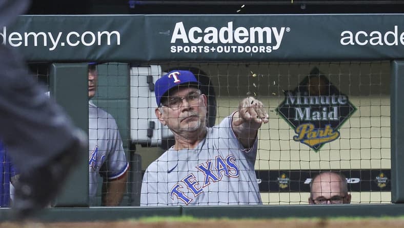 Jul 25, 2023; Houston, Texas, USA; Texas Rangers manager Bruce Bochy (15) throws seeds in the dugout after the results of a video review during the eighth inning against the Houston Astros at Minute Maid Park. Mandatory Credit: Troy Taormina-USA TODAY Sports