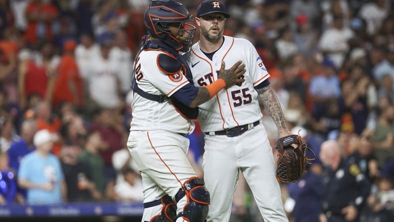 Jul 25, 2023; Houston, Texas, USA; Houston Astros catcher Martin Maldonado (15) celebrates with relief pitcher Ryan Pressly (55) after the game against the Texas Rangers at Minute Maid Park. Mandatory Credit: Troy Taormina-USA TODAY Sports