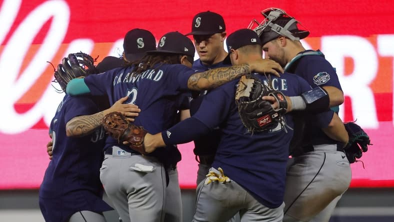 Jul 25, 2023; Minneapolis, Minnesota, USA; The Seattle Mariners celebrate their win over the Minnesota Twins at Target Field. Mandatory Credit: Bruce Kluckhohn-USA TODAY Sports