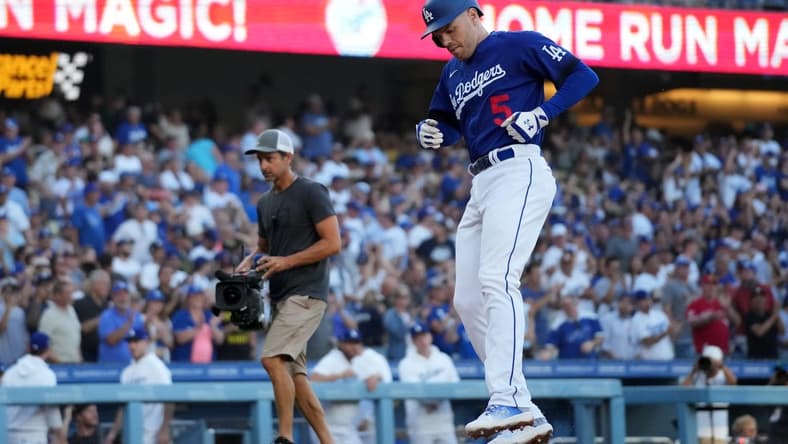Jul 25, 2023; Los Angeles, California, USA; Los Angeles Dodgers first baseman Freddie Freeman (5) crosses home plate after hitting a solo home run in the first inning against the Toronto Blue Jays at Dodger Stadium. Mandatory Credit: Kirby Lee-USA TODAY Sports