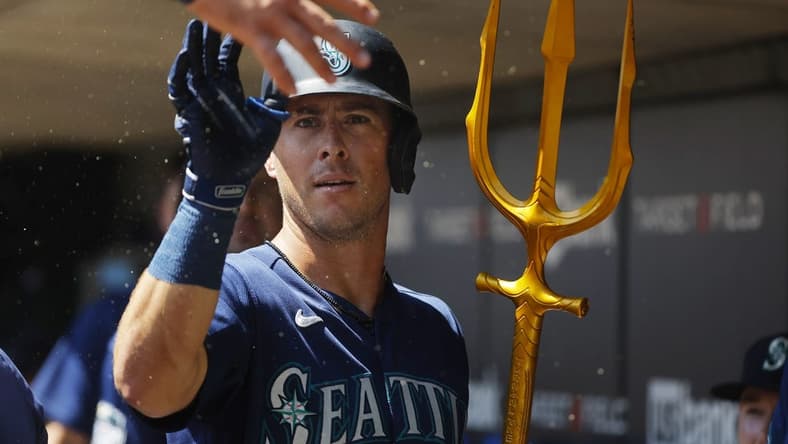 Jul 26, 2023; Minneapolis, Minnesota, USA; Seattle Mariners shortstop Dylan Moore (25) celebrates his solo home run with teammates in the dugout against the Minnesota Twins in the second inning at Target Field. Mandatory Credit: Bruce Kluckhohn-USA TODAY Sports