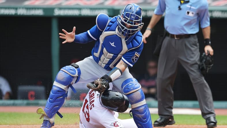 Jul 26, 2023; Cleveland, Ohio, USA; Cleveland Guardians shortstop Gabriel Arias (13) slides under the tag of Kansas City Royals catcher Freddy Fermin (34) during the second inning at Progressive Field. Mandatory Credit: Ken Blaze-USA TODAY Sports