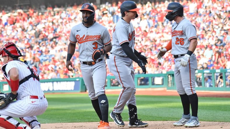 Jul 26, 2023; Philadelphia, Pennsylvania, USA; Baltimore Orioles catcher Adley Rutschman (35) celebrates his three run home run with shortstop Jorge Mateo (3) and outfielder Ryan McKenna (26) during the third inning against the Philadelphia Phillies at Citizens Bank Park. Mandatory Credit: Eric Hartline-USA TODAY Sports