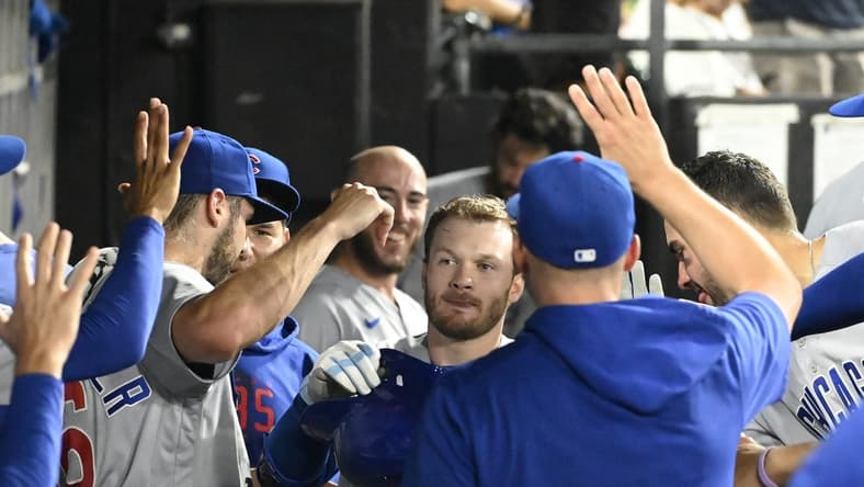 Jul 26, 2023; Chicago, Illinois, USA; Chicago Cubs left fielder Ian Happ (8), center, celebrates in the dugout after hitting a home run against the Chicago White Sox during the eighth inning at Guaranteed Rate Field. Mandatory Credit: Matt Marton-USA TODAY Sports