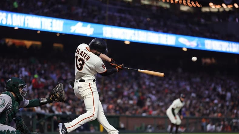 Jul 26, 2023; San Francisco, California, USA; San Francisco Giants left fielder Austin Slater (13) hits a two-run home run during the sixth inning against the Oakland Athletics at Oracle Park. Mandatory Credit: Sergio Estrada-USA TODAY Sports