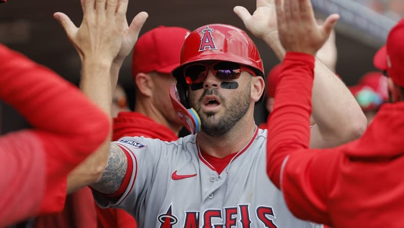 Jul 27, 2023; Detroit, Michigan, USA;  Los Angeles Angels third baseman Mike Moustakas (8) receives congratulations from teammates after scoring in the second inning against the Detroit Tigers at Comerica Park. Mandatory Credit: Rick Osentoski-USA TODAY Sports