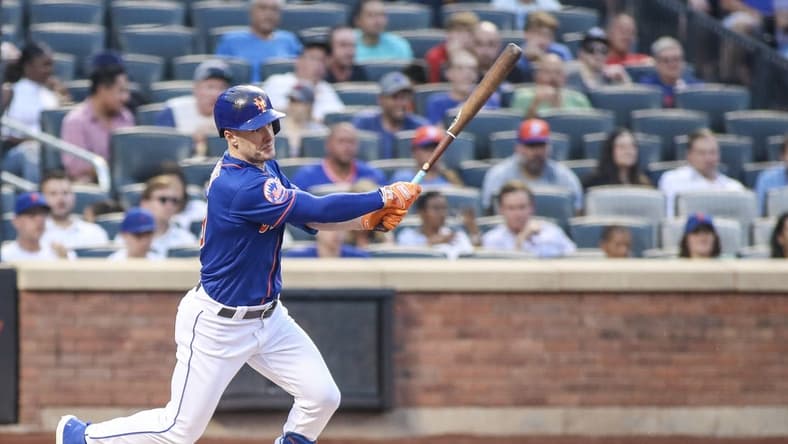 Jul 27, 2023; New York City, New York, USA; New York Mets left fielder Mark Canha (19) hits a single in the second inning against the Washington Nationals at Citi Field. Mandatory Credit: Wendell Cruz-USA TODAY Sports