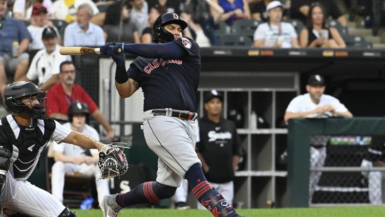 Jul 27, 2023; Chicago, Illinois, USA; Cleveland Guardians first baseman Josh Naylor (22) hits a two-RBI double against the Chicago White Sox during the third inning at Guaranteed Rate Field. Mandatory Credit: Matt Marton-USA TODAY Sports