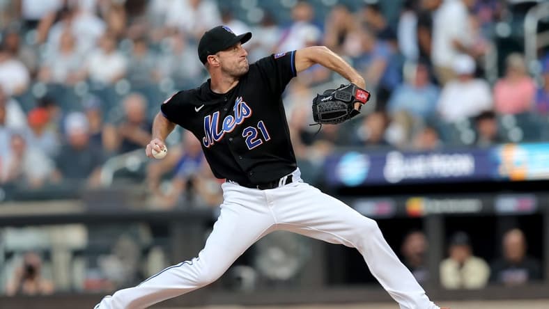 Jul 28, 2023; New York City, New York, USA; New York Mets starting pitcher Max Scherzer (21) pitches against the Washington Nationals during the first inning at Citi Field. Mandatory Credit: Brad Penner-USA TODAY Sports