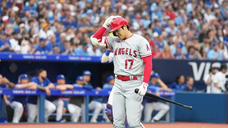 Jul 28, 2023; Toronto, Ontario, CAN; Los Angeles Angels designated hitter Shohei Ohtani (17) reacts after striking out against the Toronto Blue Jays during the third inning at Rogers Centre. Mandatory Credit: Nick Turchiaro-USA TODAY Sports