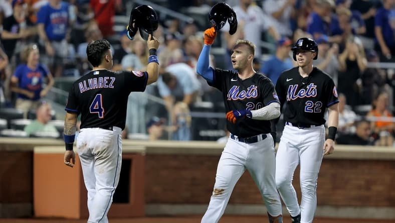 Jul 28, 2023; New York City, New York, USA; New York Mets first baseman Pete Alonso (20) celebrates his three run home run against the Washington Nationals with catcher Francisco Alvarez (4) and third baseman Brett Baty (22) during the fifth inning at Citi Field. Mandatory Credit: Brad Penner-USA TODAY Sports