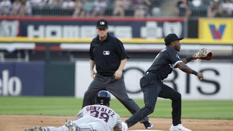 Jul 28, 2023; Chicago, Illinois, USA; Cleveland Guardians right fielder Oscar Gonzalez (39) steals second base against Chicago White Sox shortstop Tim Anderson (7) during the fifth inning at Guaranteed Rate Field. Mandatory Credit: Kamil Krzaczynski-USA TODAY Sports