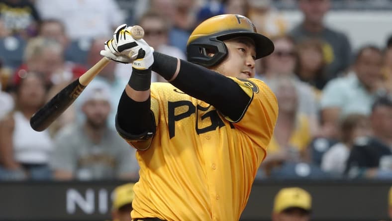 Jul 28, 2023; Pittsburgh, Pennsylvania, USA; Pittsburgh Pirates first baseman Ji Man Choi (91) hits an RBI double against the Philadelphia Phillies during the fourth inning at PNC Park. Mandatory Credit: Charles LeClaire-USA TODAY Sports