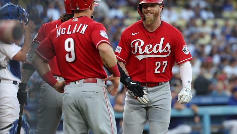 Jul 28, 2023; Los Angeles, California, USA; Cincinnati Reds right fielder Jake Fraley (27) is greeted by shortstop Matt McLain (9) after hitting a home run during the first inning against the Los Angeles Dodgers at Dodger Stadium. Mandatory Credit: Kiyoshi Mio-USA TODAY Sports