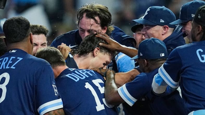 Jul 28, 2023; Kansas City, Missouri, USA; Kansas City Royals shortstop Bobby Witt Jr. (7) celebrates with teammates after hitting a walk-off grand slam against the Minnesota Twins during the tenth inning at Kauffman Stadium. Mandatory Credit: Jay Biggerstaff-USA TODAY Sports