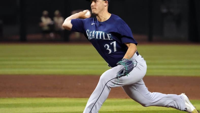 Jul 28, 2023; Phoenix, Arizona, USA; Seattle Mariners relief pitcher Paul Sewald (37) pitches against the Arizona Diamondbacks during the ninth inning at Chase Field. Mandatory Credit: Joe Camporeale-USA TODAY Sports